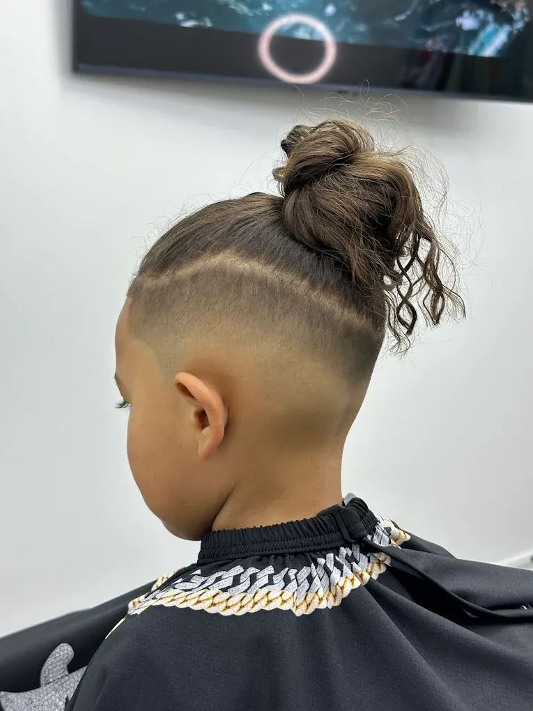 Kids haircut with a high fade and freehand hair design at Blends Barbershop