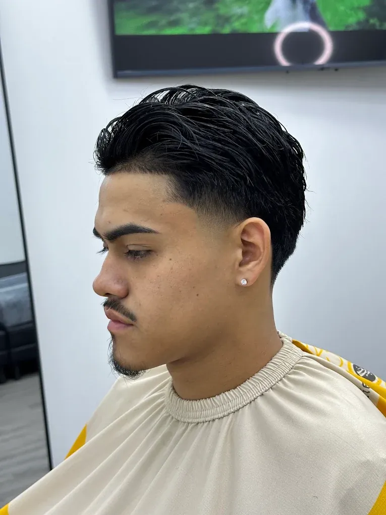 Textured comb-over with a low taper fade finished at Blends Barbershop in Denham Springs, Louisiana